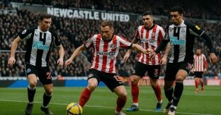 Sunderland player holding up the ball